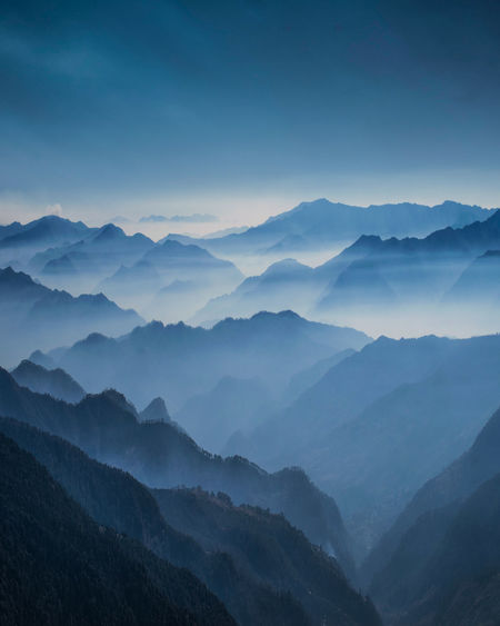 Scenic view of mountains against sky during sunset