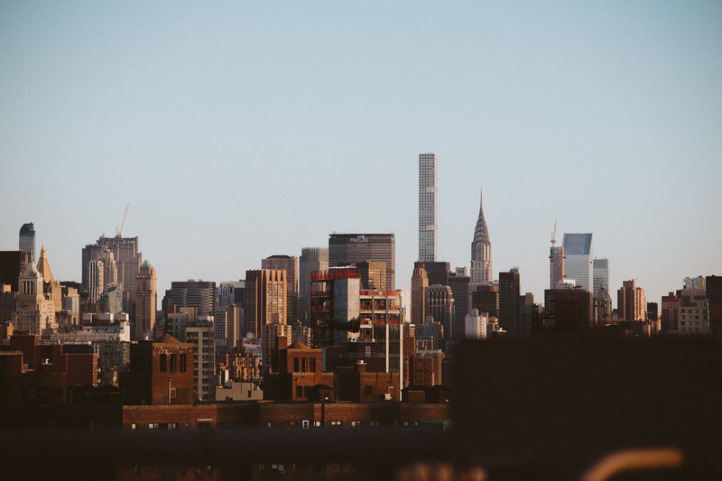 Buildings against clear sky in city