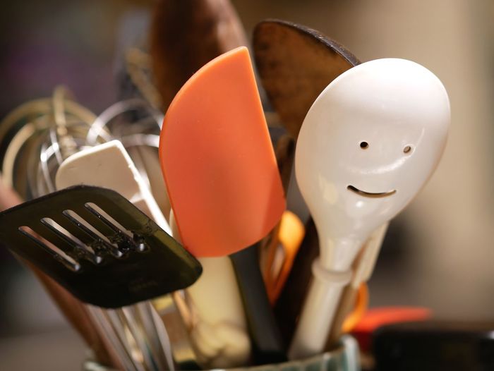 Close-up of spoons and spatulas in kitchen