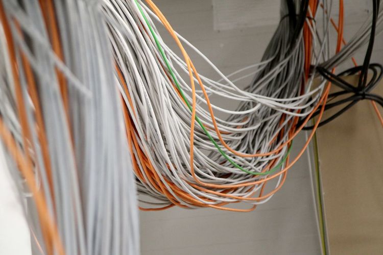 Low angle view of cables hanging in room