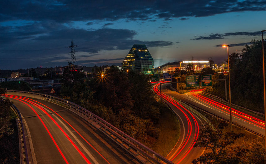High angle view of light trails on road at night