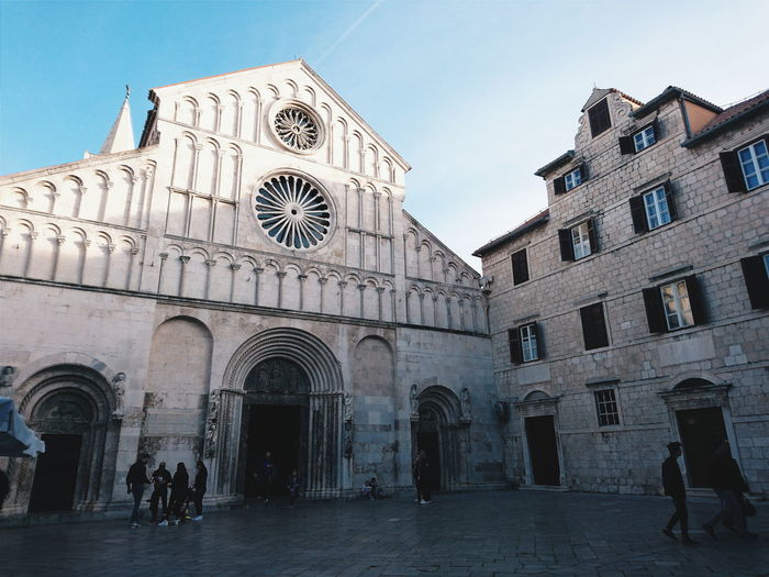 People outside zadar cathedral in city