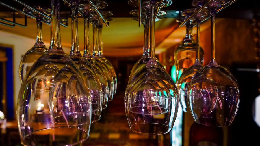 Close-up of illuminated lighting equipment hanging at store