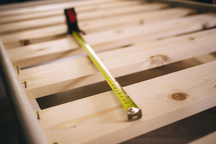 High angle view of tape measure on workbench in workshop