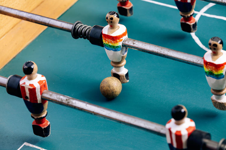 Cropped hand of man holding foosball