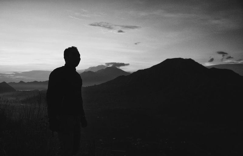 Silhouette of man standing on mountain