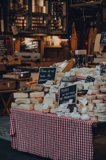 Cheese and charcuterie stand in borough market, london, uk.