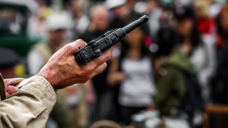 Cropped hand holding gun