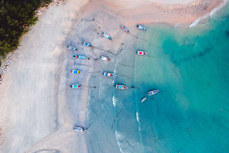 Aerial view of boats moored on beach