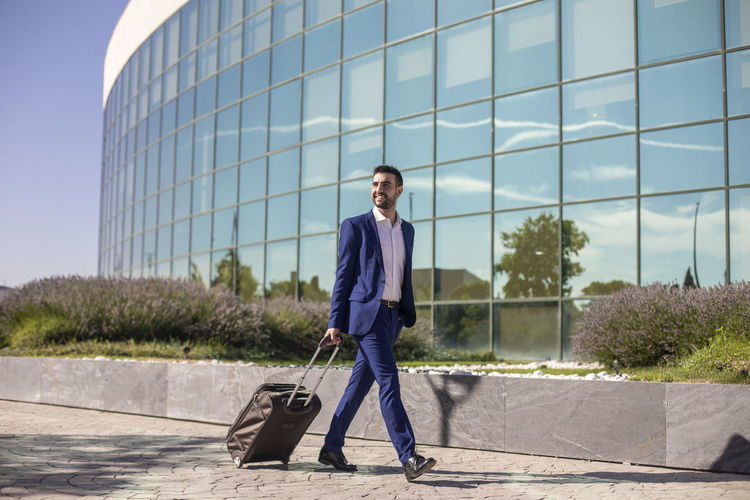Businessman with suitcase taking a business trip