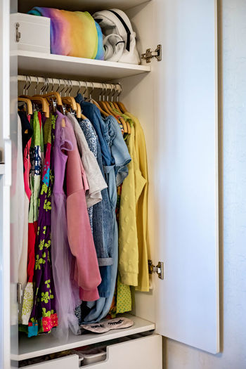 Clothes hanging in rack at home