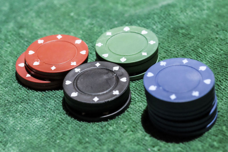 High angle view of poker chips on table
