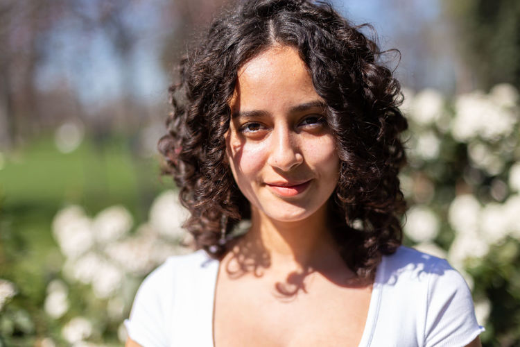 Portrait of young woman looking away