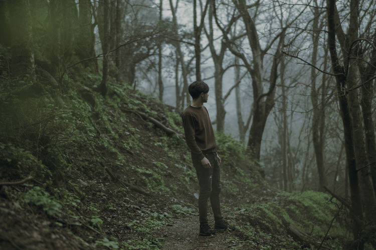 Man standing in forest