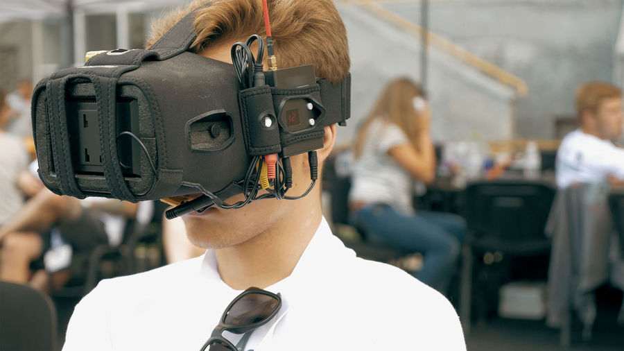 Close-up of man wearing virtual reality simulator