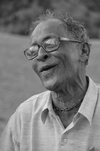 Close-up of smiling man wearing eyeglasses