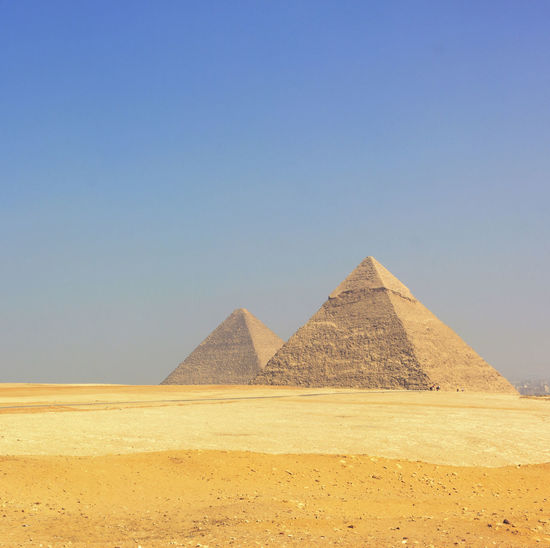Scenic view of giza pyramids against clear sky