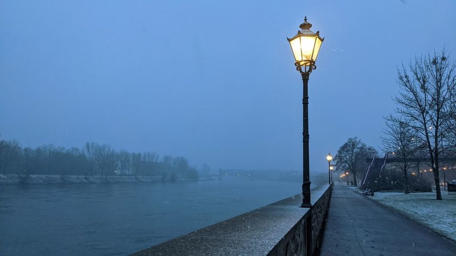 Street light against sky during winter