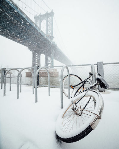 Bicycle covered in deep snow