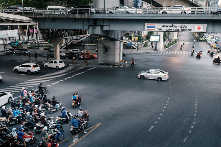 Thai-japanese friendship bridge at silom intersection area with heavy traffic at rush hour
