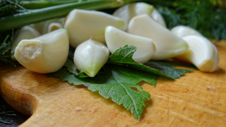 Close-up of garlic on cutting board