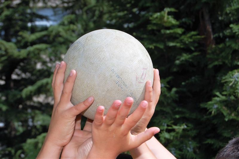 Close-up of hands holding ball