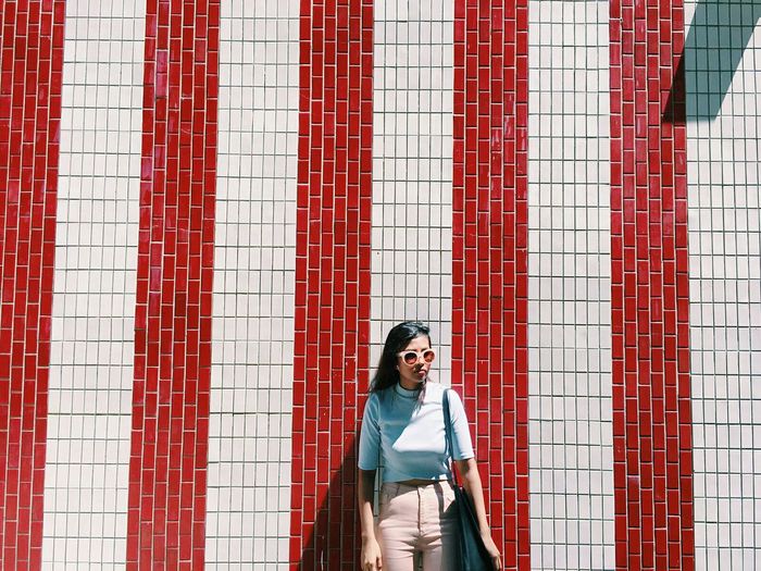 Portrait of young woman using phone