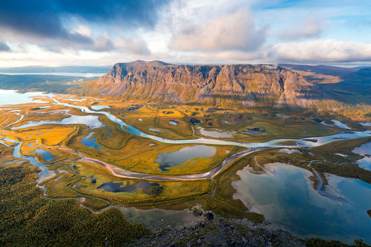 Aerial view of landscape against cloudy sky. rapa valley, sarek np, sweden.