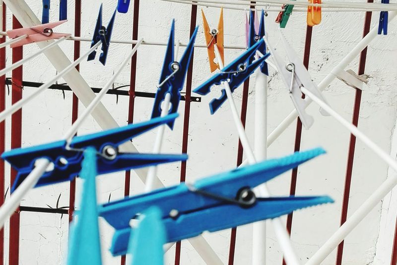 Colorful clothespins on rows