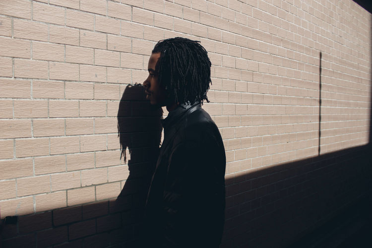 Brick Wall Shadow Leisure Activity Lifestyles City Day Young Adult Streetphotography EyeEmNewHere EyeEm Gallery Building Exterior Portrait Boys Wall Abstract Detail Canon Camera Teenager Africa Abstract Photography Black Wall Art The Week On EyeEm