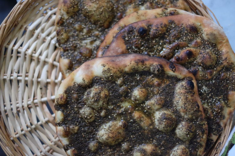 Close-up of naan breads in wicker container