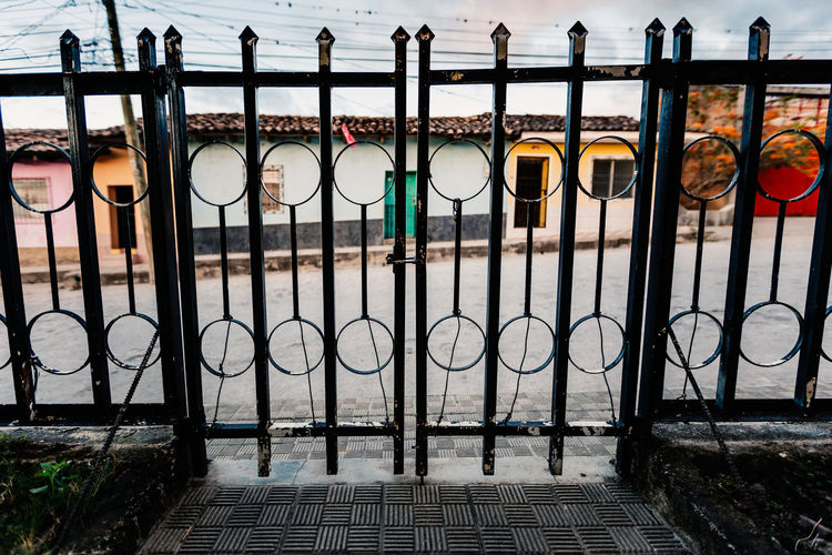 Houses seen through closed gate