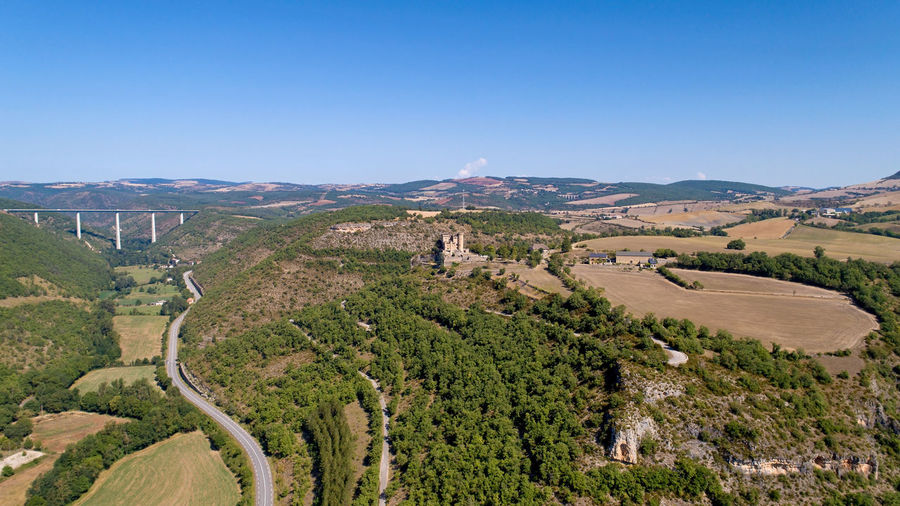 High angle view of landscape against clear blue sky