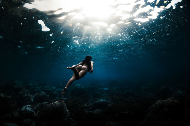 Young woman swimming in sea