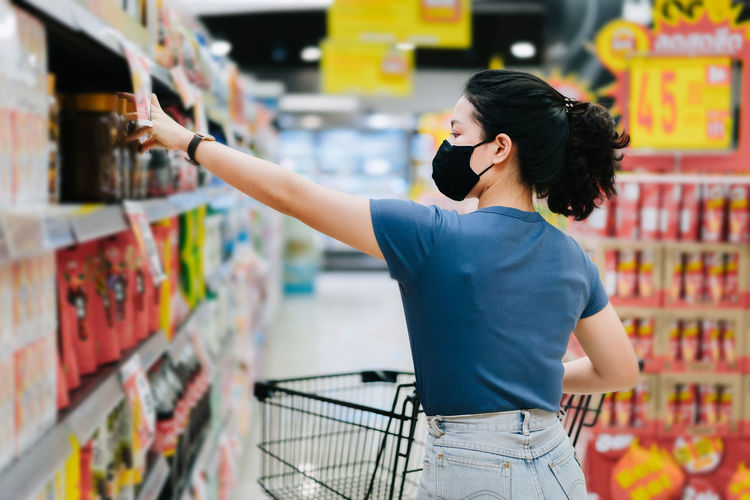 Full length of woman standing in store