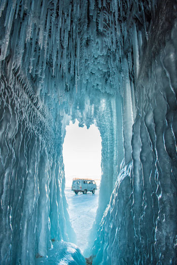 Van seen through ice cave