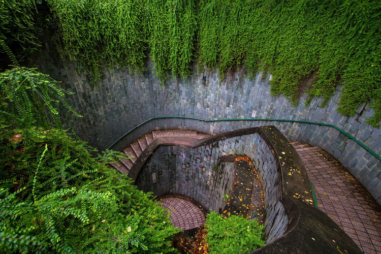A spiral staircase of an underground crossing in tunnel at fort canning park, singapore.
