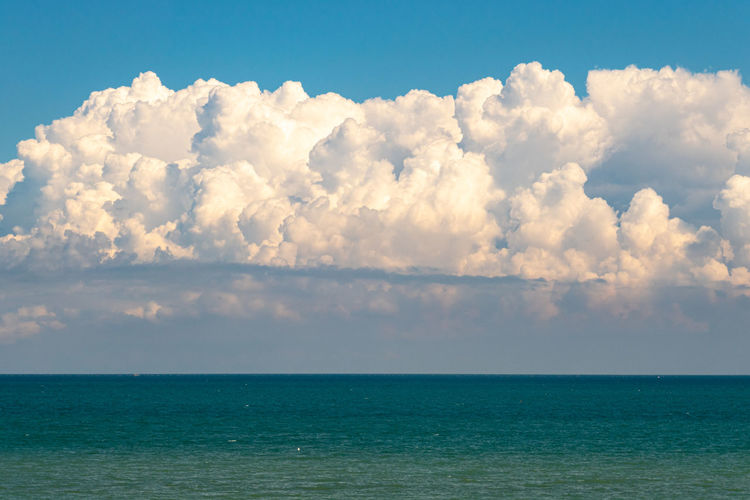 Minimal colorful landscape of sea and clouds
