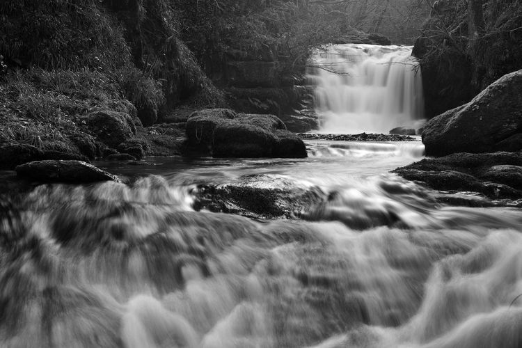 Black and white photo of the waterfall at watersmeet in exmoor 