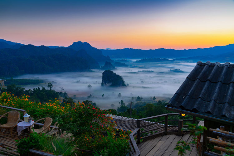 Sunrise and morning mist at pha chang noi viewpoint, phu langka national park, phayao , thailand.