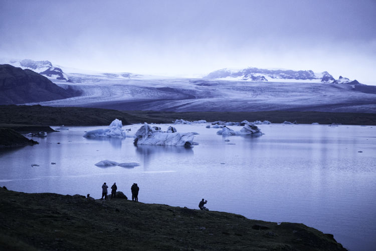 People by glacier lake