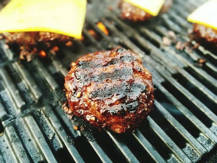 Close-up of hamburgers on grill