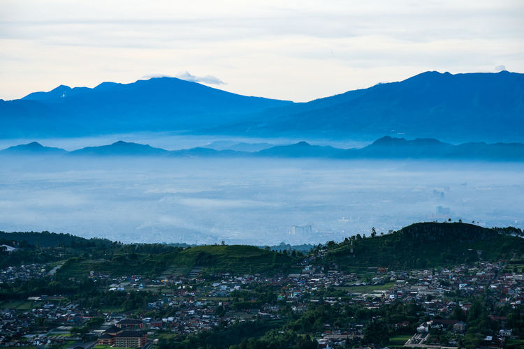 High angle view of landscape and mountains against sky