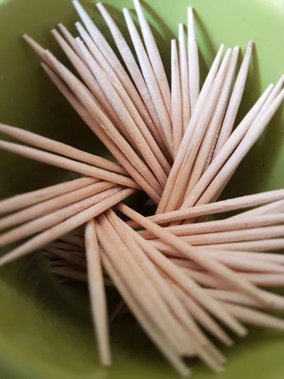 Close up of toothpicks in container