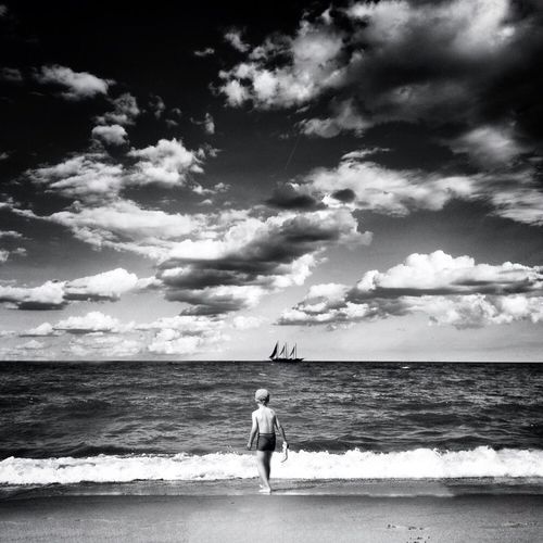 Scenic view of sea against cloudy sky