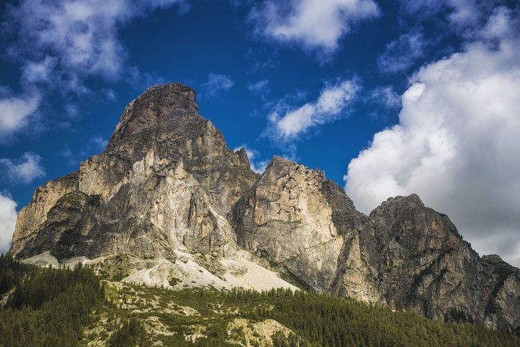 Low angle view of rocky mountains at corvara