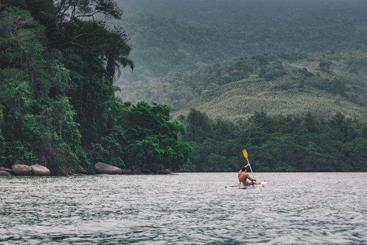 Man kayaking on water