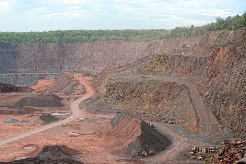 Empty open-pit mining against sky