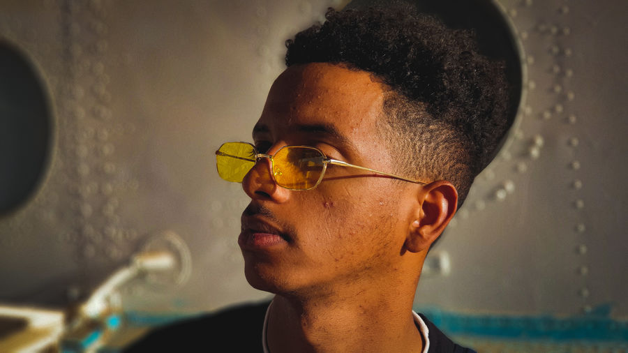 Close-up portrait of young man with eyeglasses