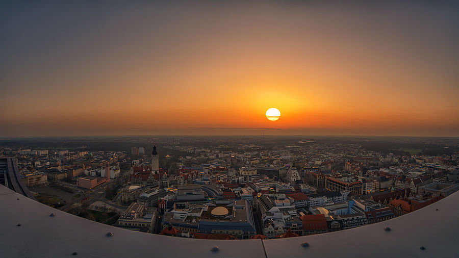 High angle view of city buildings during sunset